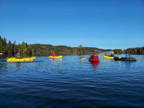 Peaceful packrafting on a quiet forest lake